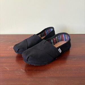 Toms Black Canvas Slip-Ons with Striped Lining
